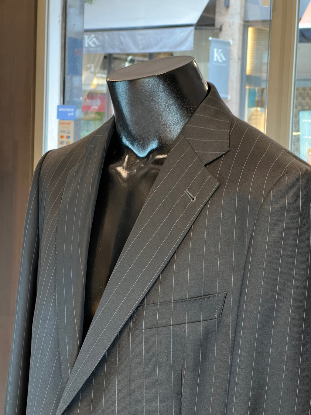 Light grey John Blond suit jacket with classic notch lapel and subtle texture.