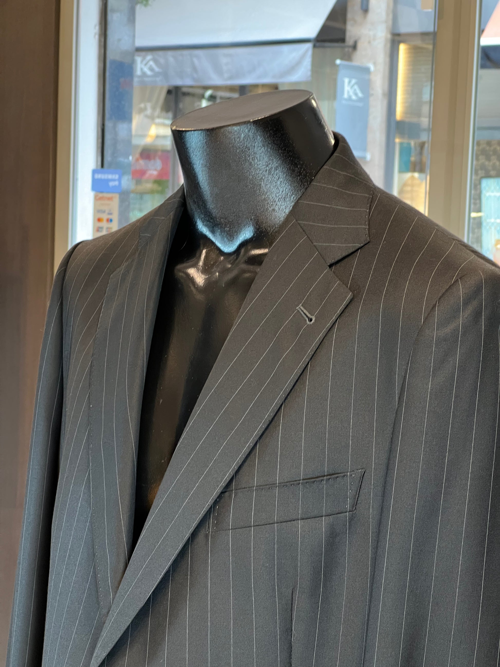Light grey John Blond suit jacket with classic notch lapel and subtle texture.